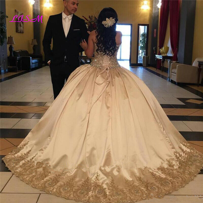 champagne and gold quinceanera dress,gold quinceanera dress,plus size dress for quinceanera,satin quinceanera dress,strapless sweetheart quinceanera dress,inexpensive quinceanera dress,cheap quinceanera gown under 200 dollars,