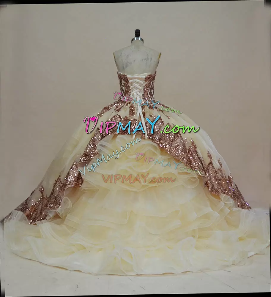 ready to ship quinceanera dresses,customize your own quinceanera dress,customize quinceanera dress online,champagne colored quinceanera dress,champagne quinceanera dress with ruffles,champagne and gold quinceanera dress,champagne quinceanera dress,bell sleeve quinceanera dress,rose gold quinceanera dress,sequined bodice quinceanera dress,sequined quinceanera dress,ruffled skirt sweet 16 dress,quinceanera dress with ruffles,sweetheart quinceanera dress,