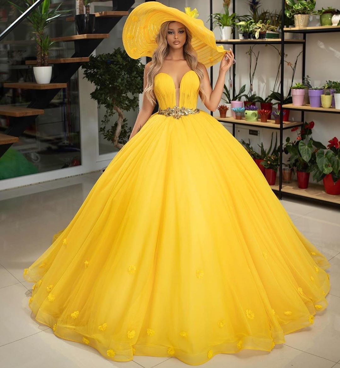 bright yellow quinceanera dress,yellow quinceanera dress,deep v neckline quinceanera dress,tulle skirt quinceanera dress,handmade flower quinceanera dress,most beautiful quinceanera dress flowers theme,quinceanera dress with belt,customize your own quinceanera dress,