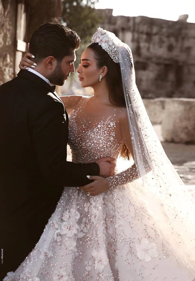 wedding dress with chapel train,wedding dress with long trains,wedding dress with rhinestones,wedding dress with 3d flowers,long sleeve illusion wedding dress,long sleeve wedding dress with long trains,long sleeved plus size wedding dress,wedding dress with lots of crystals,huge ball gown wedding dress with crystals,