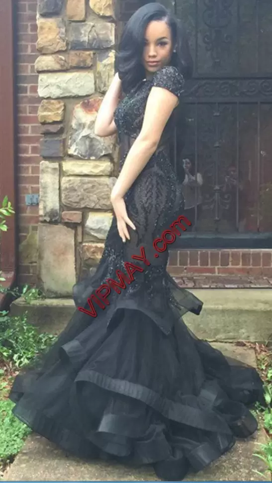 black see through prom dress,black mermaid style prom dress,beaded special occasion prom dress,fully beaded prom dress,short sleeve backless prom dress,short sleeve occasion prom dress,prom dress with high neck,high neck beaded prom dress,prom dress with mermaid bottom,vintage mermaid prom dress,sheer mermaid prom dress,expensive formal dress,