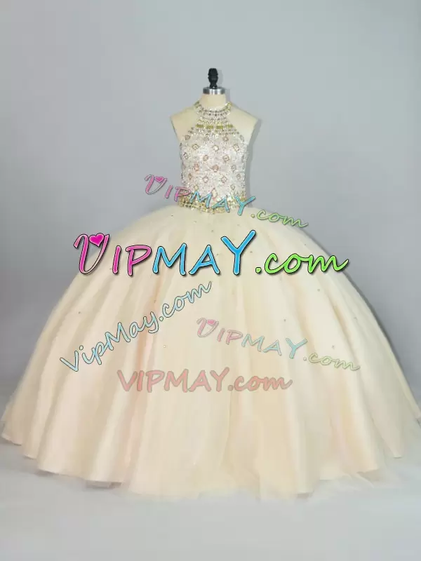 cut out back quinceanera dress,15th birthday dress,tulle skirt quinceanera dress,quinceanera dress with halter neckline,halter high neck quinceanera dress with bling,champagne colored quinceanera dress,