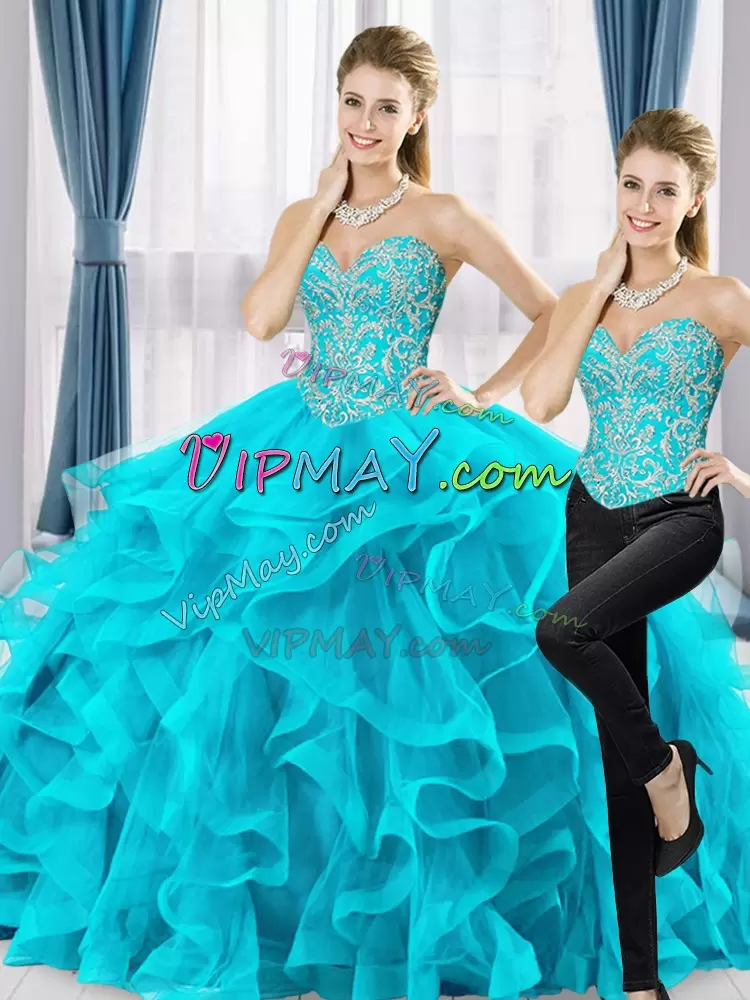 beaded two piece quinceanera dress,quinceanera mall 2 piece dress,beaded top quinceanera dress,ruffled quinceanera dress,strapless sweetheart quinceanera dress,aqua colored quinceanera dress,