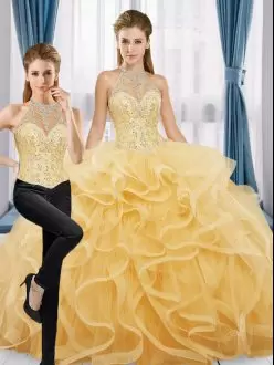 Affordable Halter Top Sleeveless Ball Gown Prom Dress Floor Length Beading and Ruffles Gold Tulle